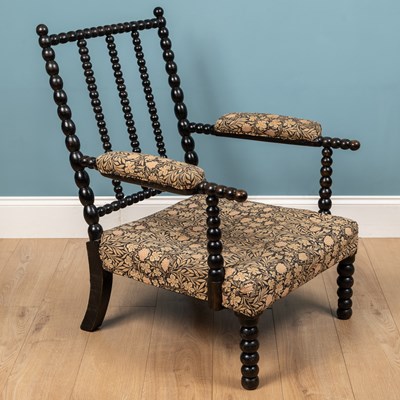 Lot 576 - A 19th century ebonised bobbin chair