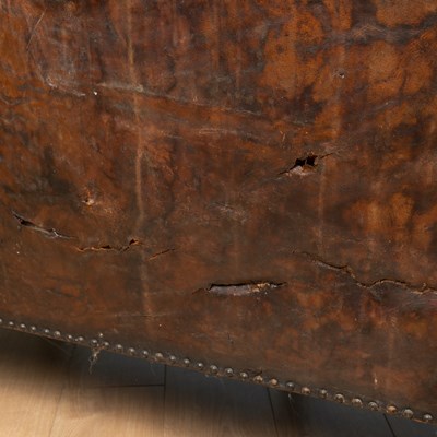 Lot 278 - A brown leather camelback sofa