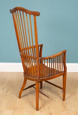 Lot 161 - An early 20th century spindle back armchair
