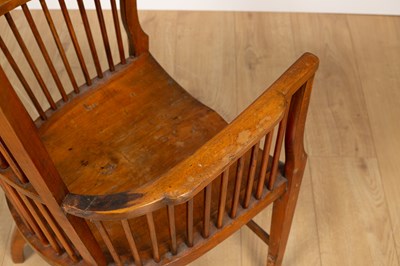 Lot 161 - An early 20th century spindle back armchair