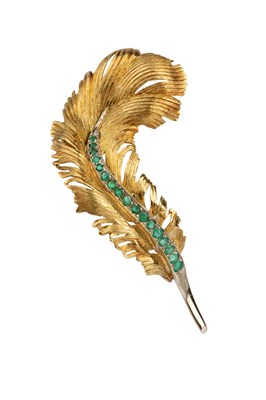 Lot 128 - An emerald panel brooch, naturalistically...