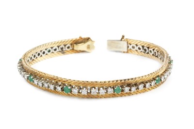 Lot 130 - An emerald and diamond bracelet, designed as a...