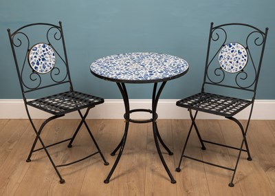 Lot 1123 - A wrought iron bistro table