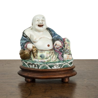Lot 148 - Polychrome decorated seated porcelain buddha...