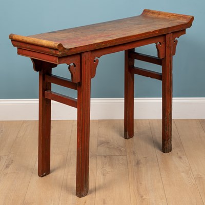 Lot 386 - A Chinese softwood red lacquered small altar table