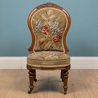 Lot 254 - A Victorian walnut nursing chair
