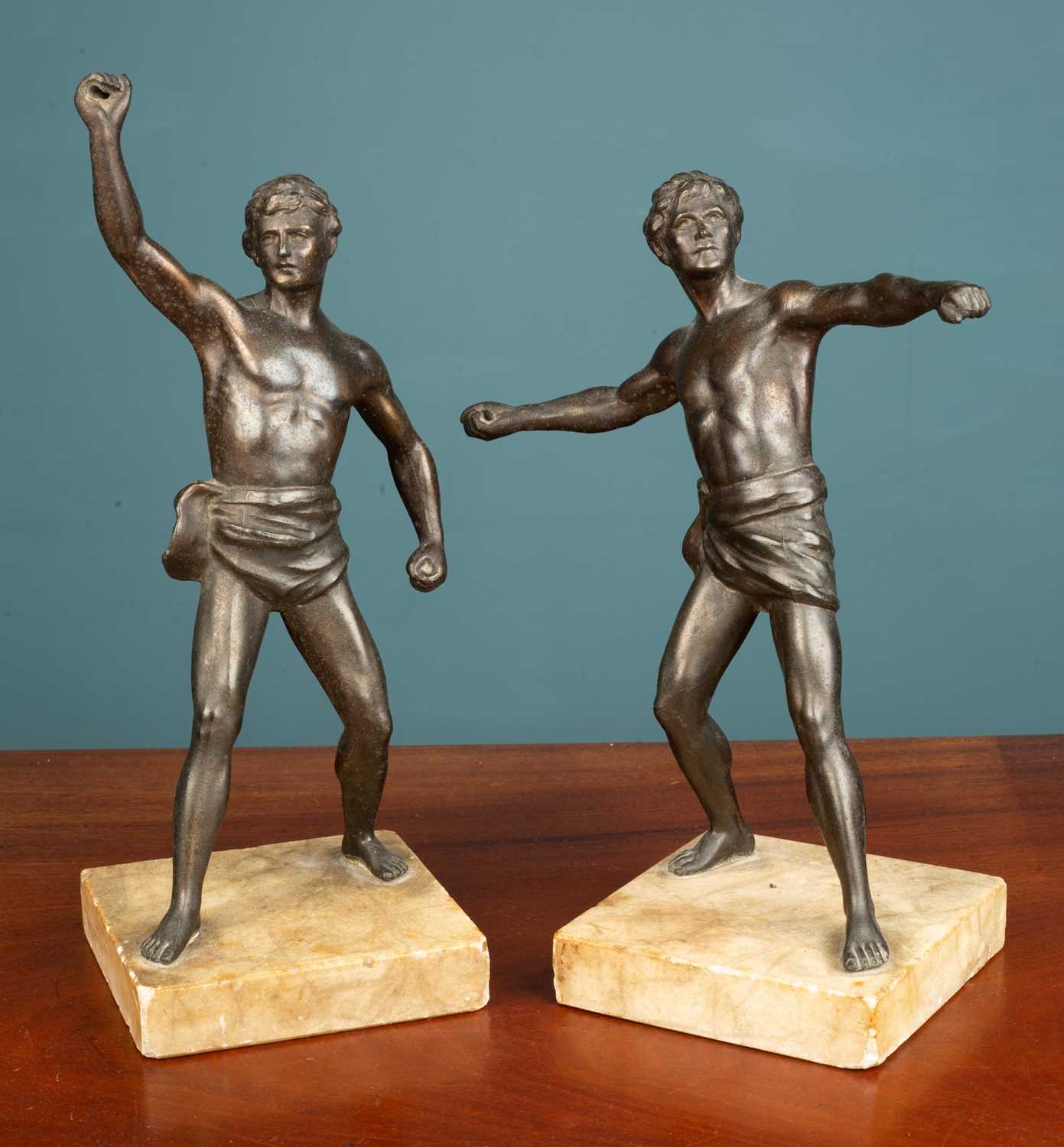 Lot 248 - A pair of French Art Deco style bronzed effect spelter athletes