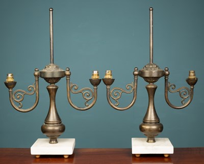 Lot 176 - A pair of French Empire-style brass lamps