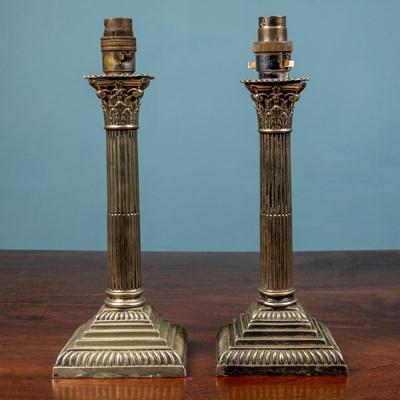 Lot 516 - A pair of silver plated table lamps