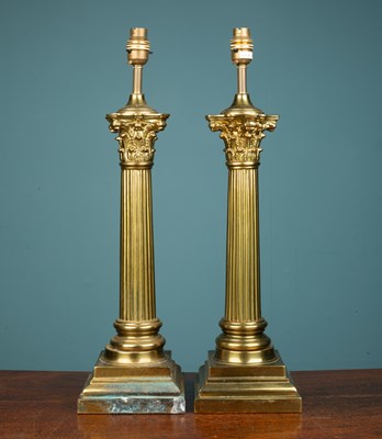 Lot 496 - A pair of large brass corinthian table lamps