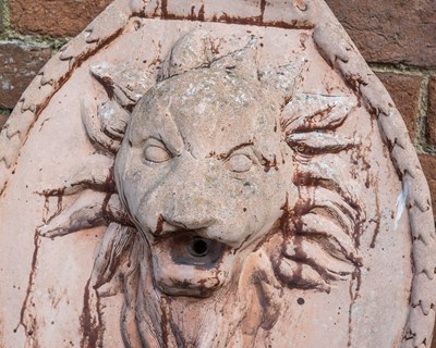 Lot 1115 - A terracotta wall fountain