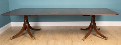 Lot 499 - A modern mahogany dining table