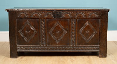 Lot 324 - An antique coffer with a triple panel front