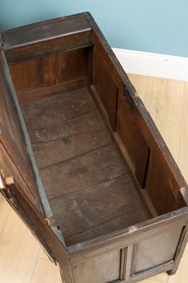 Lot 324 - An antique coffer with a triple panel front