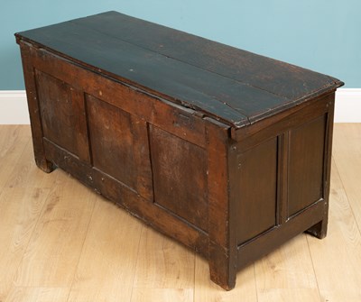 Lot 324 - An antique coffer with a triple panel front