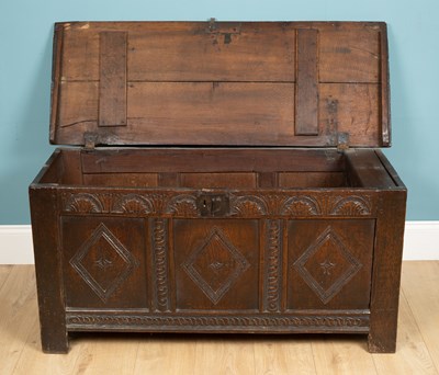 Lot 324 - An antique coffer with a triple panel front