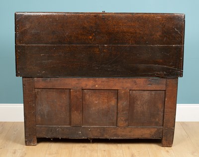Lot 324 - An antique coffer with a triple panel front