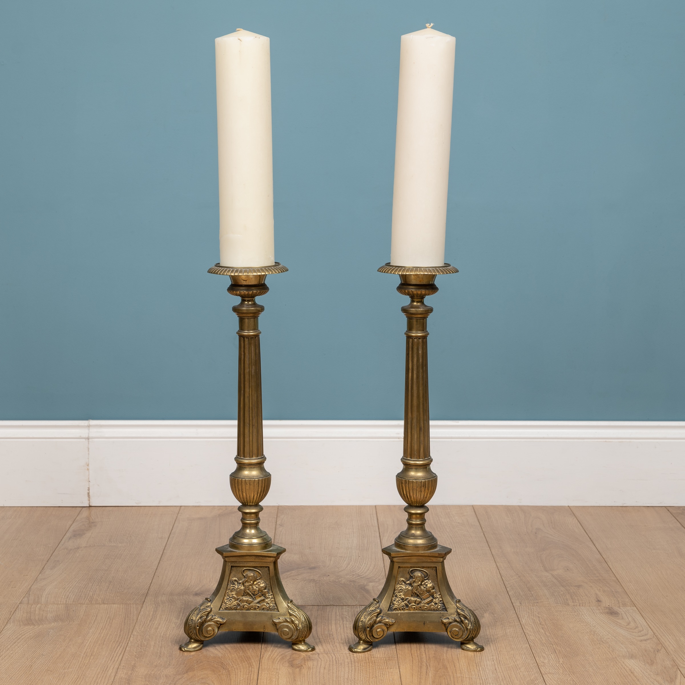 Lot 432 - A pair of large brass candlesticks