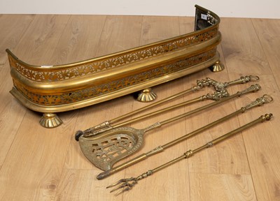 Lot 488 - A 19th century pierced brass fender; together with a set of three brass fire irons and a brass extending toasting fork