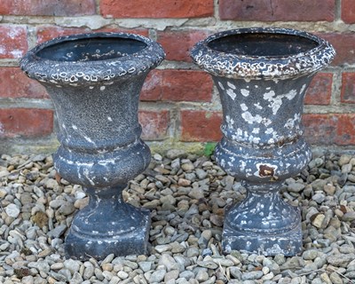 Lot 1205 - A pair of small painted cast iron urns