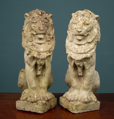 Lot 1177 - A pair of weathered concrete lion garden statues