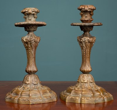 Lot 226 - A pair of ornate bronze candlesticks