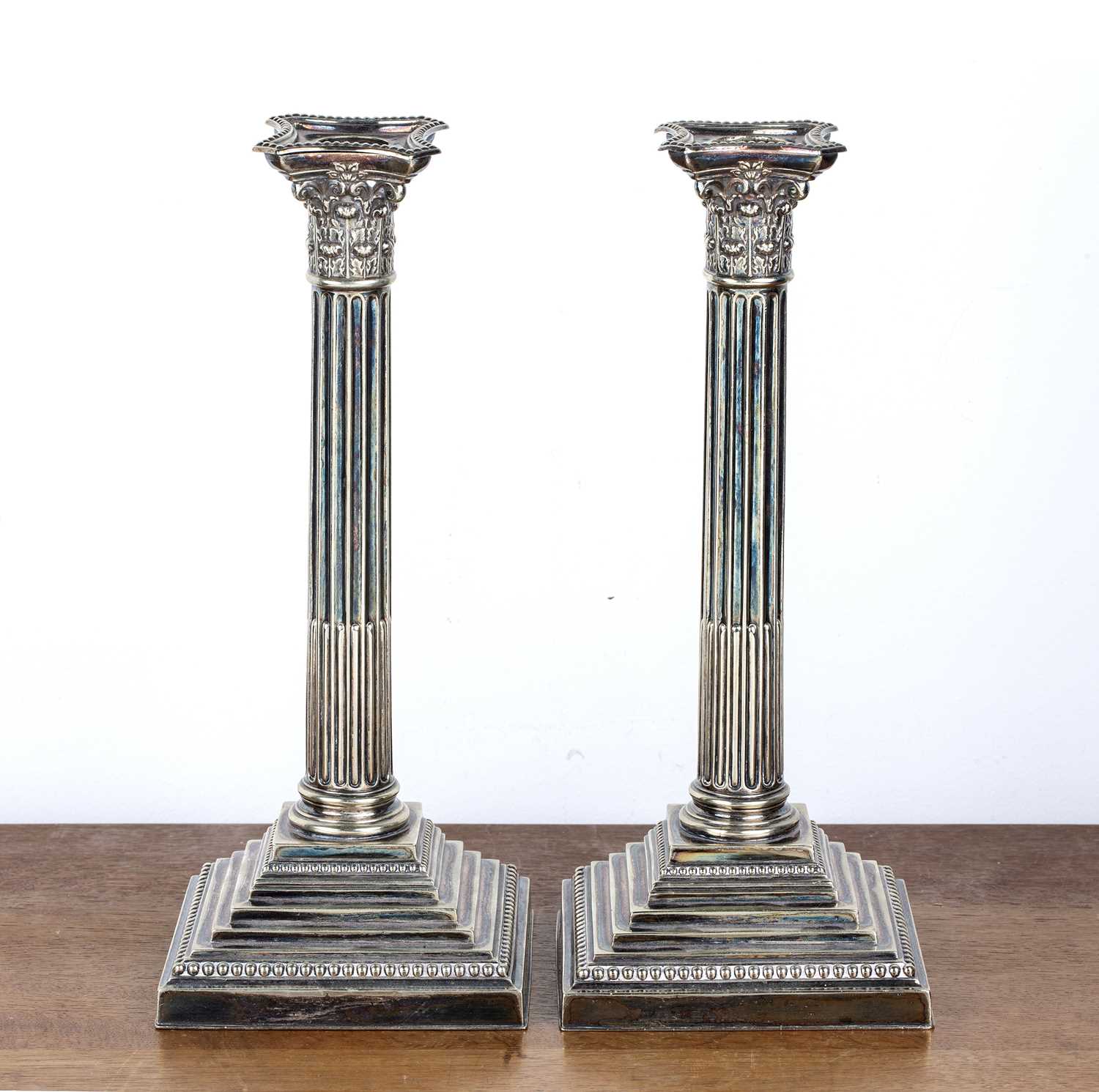 Lot 383 Pair of silver plated candlesticks of