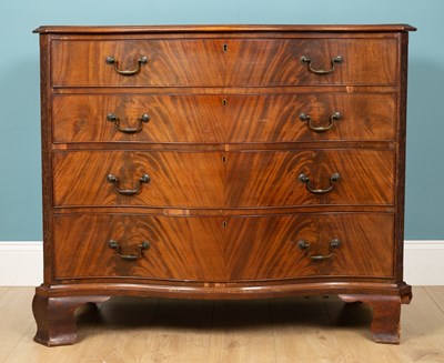 Lot 462 - A George III style mahogany serpentine chest of four long drawers