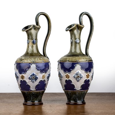 Lot 309 - Royal Doulton Lambeth Pair of pottery ewers...