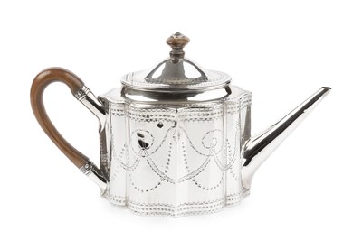 Lot 803 - A George III silver teapot, of shaped oval...