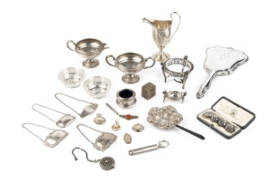 Lot 817 - A collection of silver, comprising a helmet...