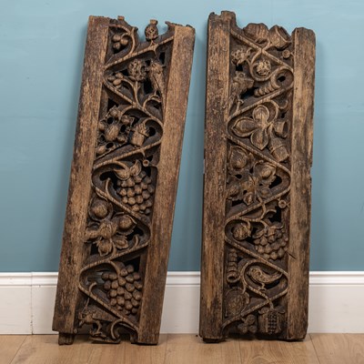 Lot 338 - A pair of English oak carved panels