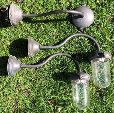 Lot 1160 - A set of three brass external wall lights