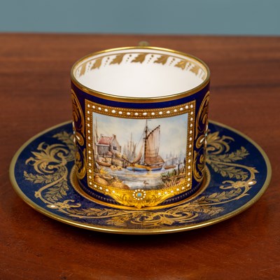 Lot 71 - A 19th century Derby Stevenson & Hancock white glazed menu holder and a Royal Crown Derby coffee can and saucer