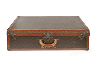 Lot 148 - A Louis Vuitton suitcase, with studded leather...