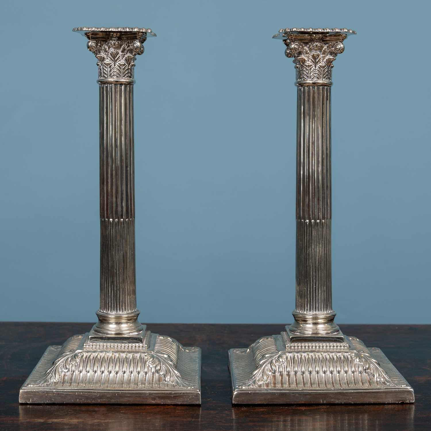 Lot 13 - A pair of antique silver plated candle sticks