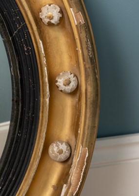 Lot 531 - A regency circular gilt framed convex wall mirror