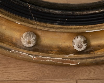 Lot 531 - A regency circular gilt framed convex wall mirror
