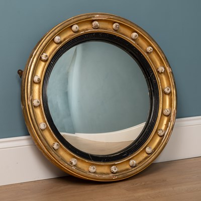 Lot 531 - A regency circular gilt framed convex wall mirror