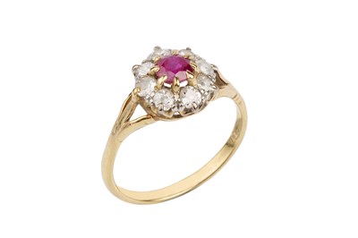 Lot 127 - A ruby and diamond cluster ring, the circular...