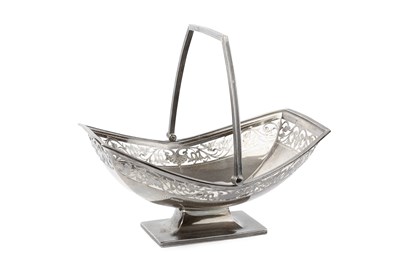 Lot 802 - A George V silver swing handled cake basket,...