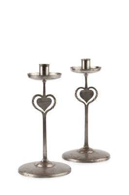 Lot 668 - Arts and Crafts A pair of candlesticks pewter...