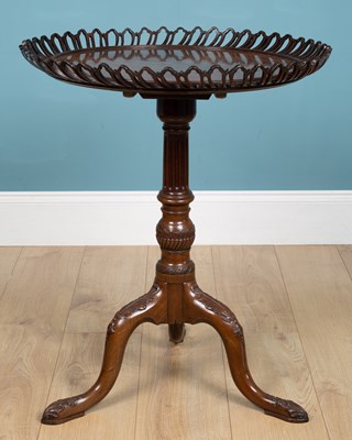 Lot 394 - An antique mahogany tripod table