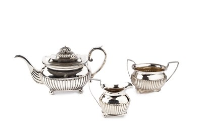 Lot 833 - A George III silver teapot, of half-lobed...