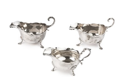 Lot 835 - A pair of George V silver sauce boats, with...