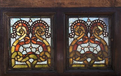 Lot 1229 - An oak framed stained glass panel