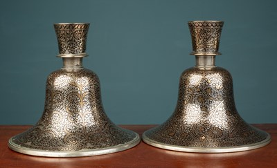 Lot 558 - A pair of Indian Mughal style silver and brass inlaid hookah bases