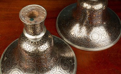 Lot 558 - A pair of Indian Mughal style silver and brass inlaid hookah bases