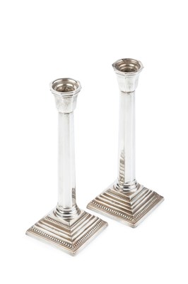 Lot 564 - A pair of George VI silver candlesticks, with...