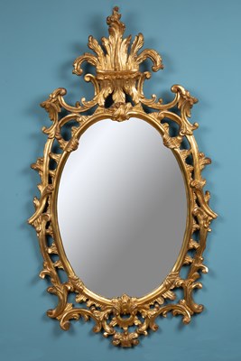 Lot 131 - A large Rococo style giltwood wall mirror